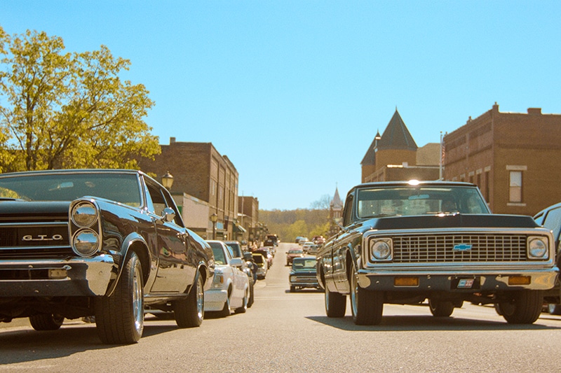 classic cars driving through town | Trigg County, Kentucky